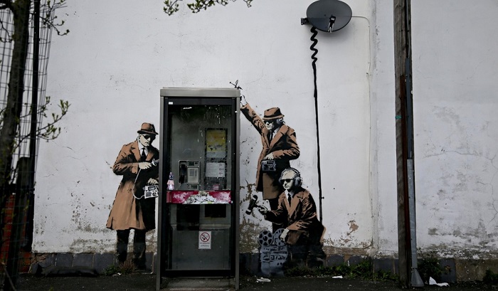 Banksy has confirmed that he painted three spies near GCHQ in Cheltenham.