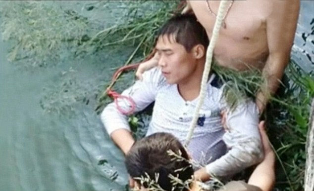 Pic shows: One moment of the rescue of the groom Kang Hu who tried to drown himself after seeing his ugly bride. A groom who turned up at his arranged marriage was so upset when he saw his bride for the first time that he tried to drown himself. Kang Hu, 33, stunned guests, family and friends when he apologised to bride Na Sung, 30, but said she was "too ugly" and then walked out of the venue in the city of Shiyan in central Chinas Hubei province. Pal Chan Wang said: "It was a very awkward moment for everyone. "The bride was devastated, her family were furious, his family were furious, and we his friends were embarrassed. "Kang has very exact tastes and had been forced into this marriage." He was spotted several hours later wandering along a river bank before throwing himself in. Passers-by called the police as they rushed down to help. Qan Tsui, 25, who took photos of the rescue said: "He was fully clothed and floating face down in the water. "He was unconscious and I thought he was dead. "When the police arrived one jumped in and dragged him ashore with the help of foremen who put a rope around his chest to pull him out before pumping his chest. "They saved his life." Kang was rushed to hospital where doctors said he was in a stable condition. He later explained: "I feel bad about what happened but when I saw her she wasnt what I had expected and I realised she would be bad for my image. "My parents had arranged this and I couldnt see any way out apart from suicide." (ends)  